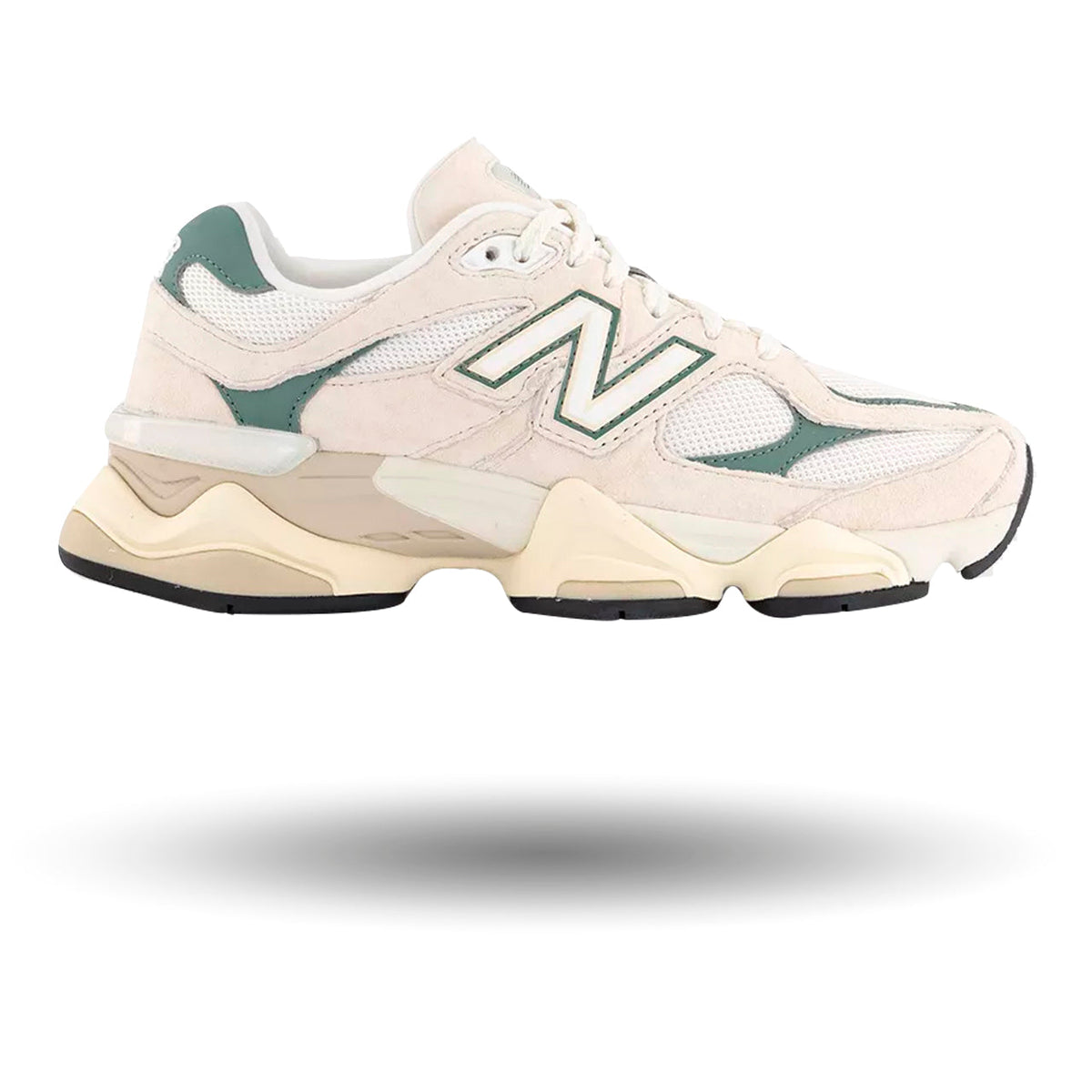 Beige sneaker with green accents on a white background